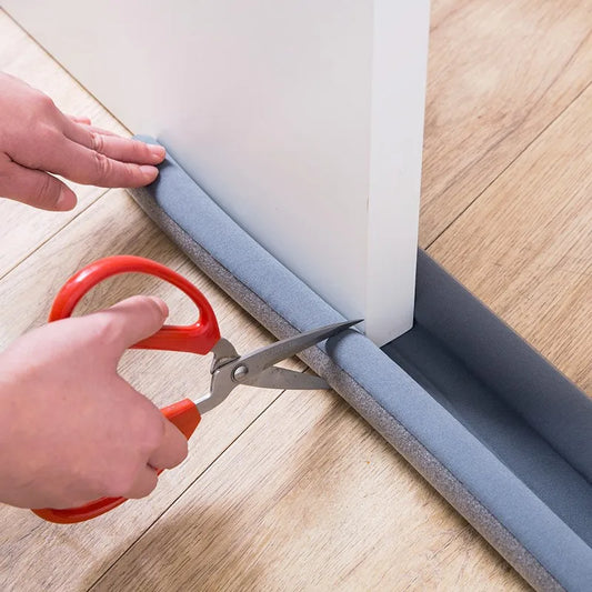 Person cutting the Double-Sided Door Bottom Sealing Strip – Wear-Resistant Leather Draft Stopper for easy installation.
